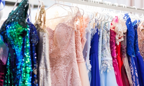 Rack with chic evening dresses.